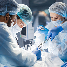 diverse team of surgeons and nurses operating on a patient