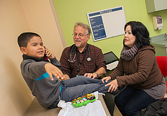 Dr. Sadof with pediatric patient