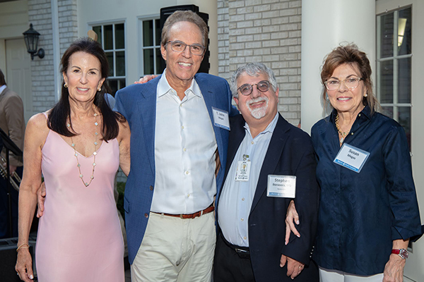 Michele Megas-Ditomassi joins T. John Megas, Dr. Stephen Bonasera, and Susan Megas at a celebration event at her home in Longmeadow, Mass.
