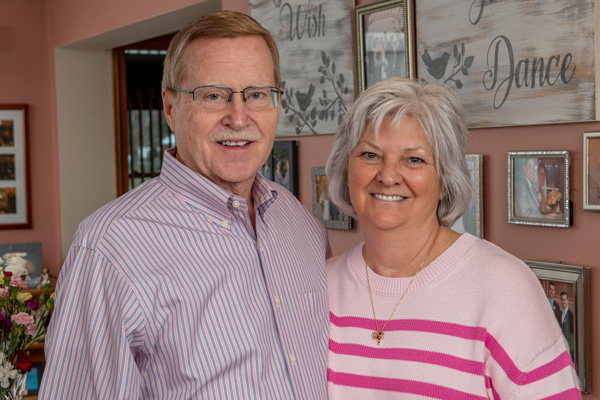 John and Sandy Maybury posed together in their home