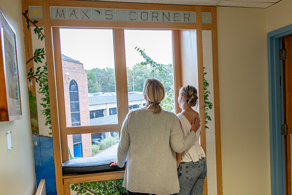 Nicole Preston-Cullen and her daughter Parker looking out the window at Max's Corner, a special place at Baystate Children's Hospital created in memory of her son, Max.