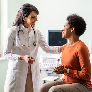 doctor consults with a woman patient in a gynecology office