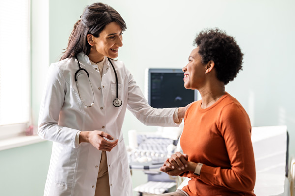 doctor consults with a woman patient in a gynecology office